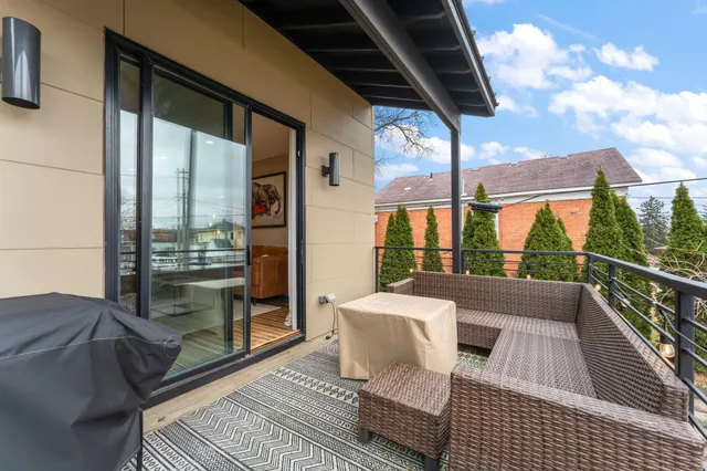 a view of hallway with wooden floor