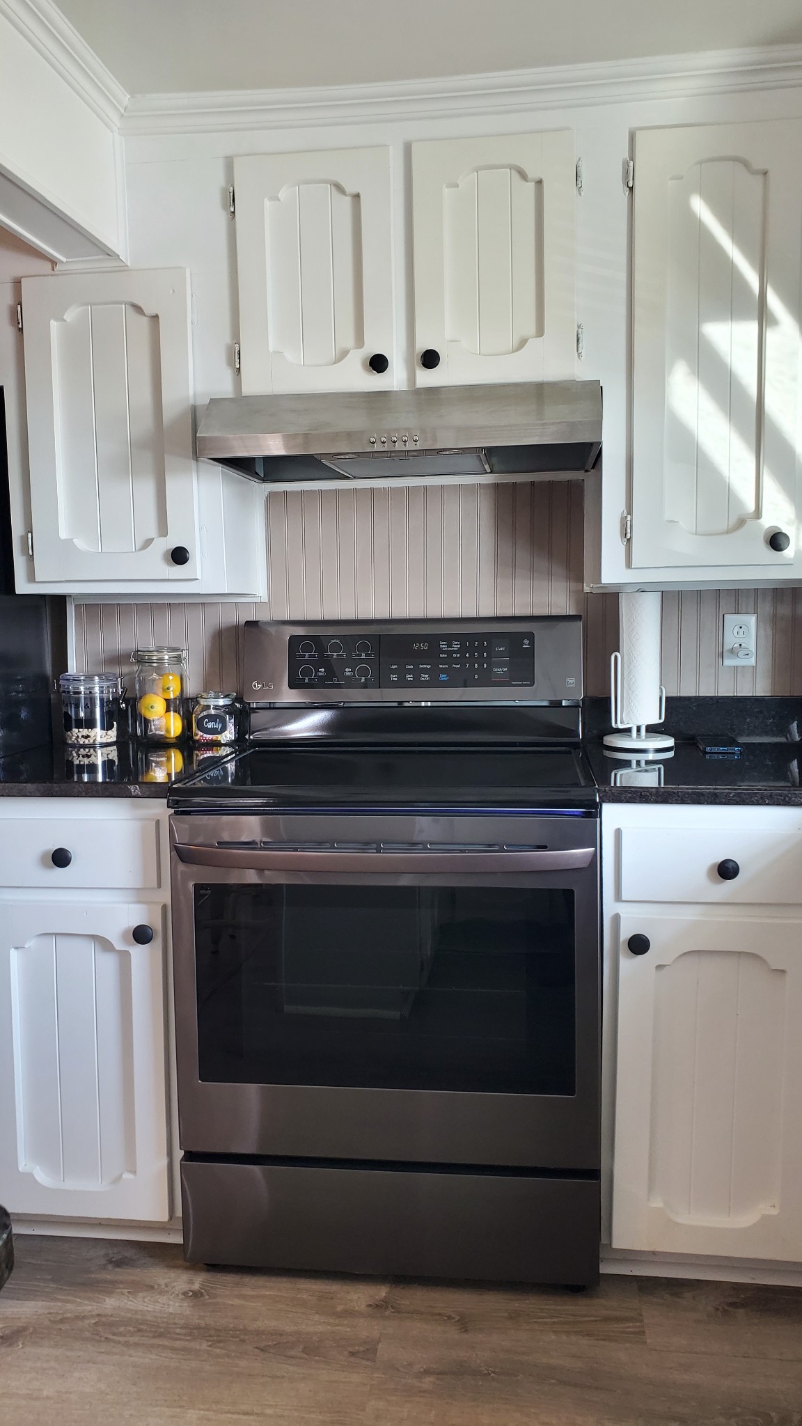 2073 Fall River Road Leoma, TN 38468 - Photo 6 of 44 a kitchen with granite countertop white cabinets and stainless steel appliances
