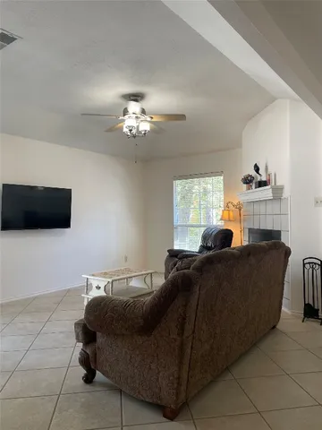 a living room with furniture and a window