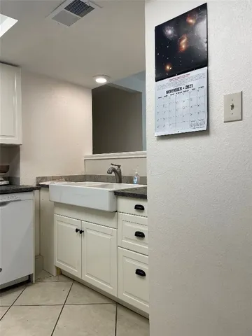 a bathroom with a sink a mirror and a vanity