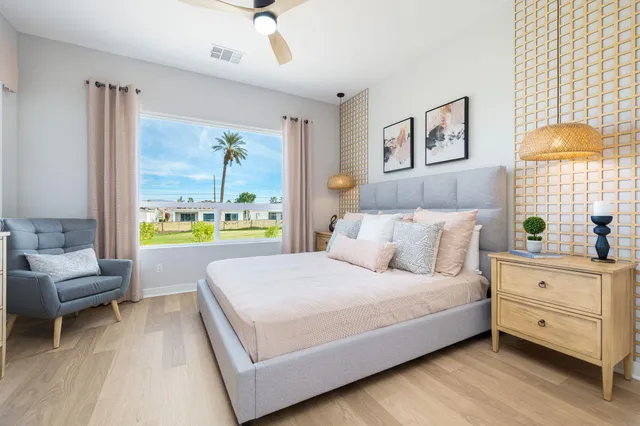 a bedroom with a bed and a couch