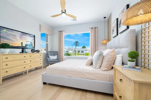 a bedroom with a large bed and a window