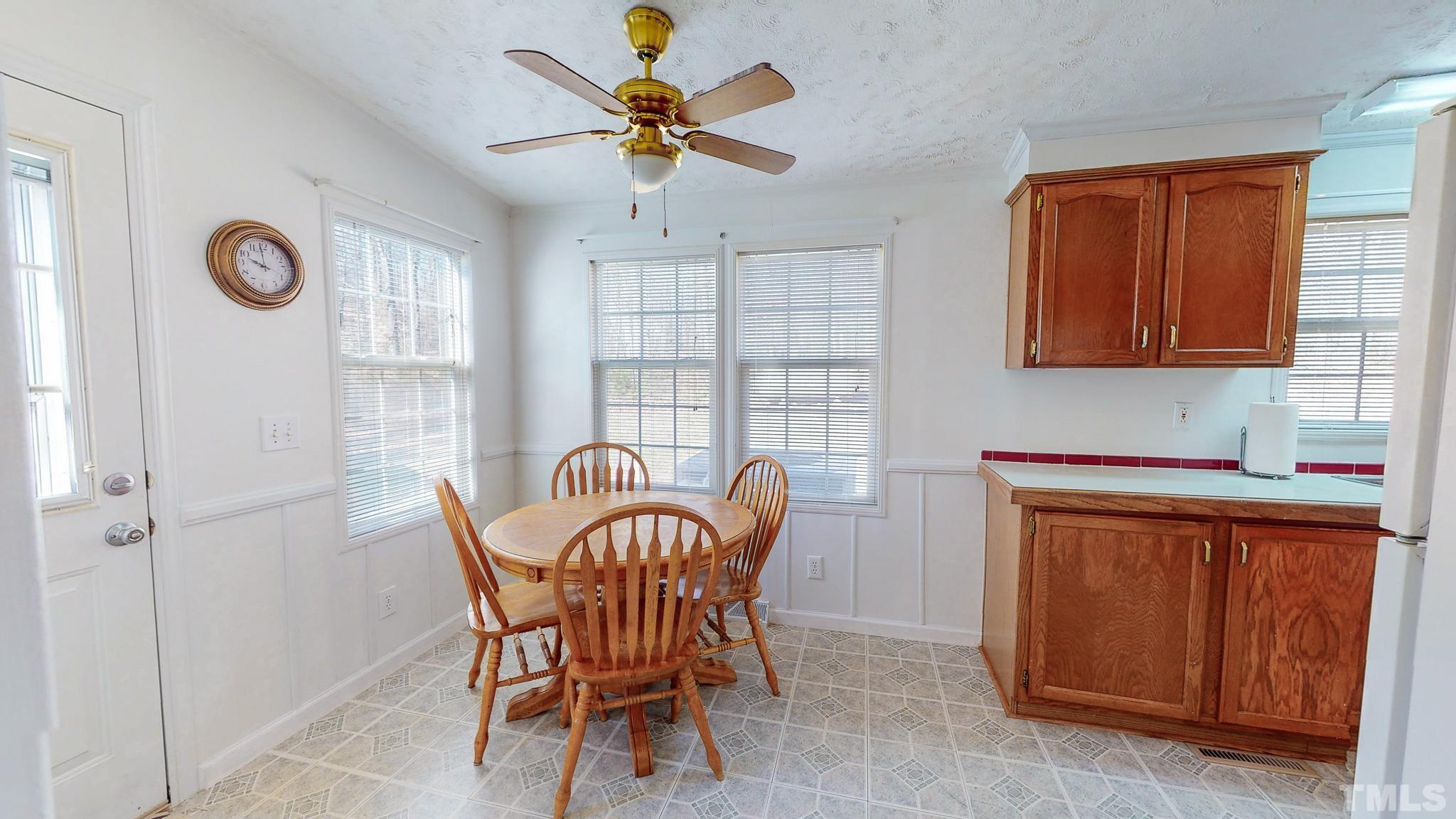 214 Hassel Clayton Road Roxboro, NC 27574 - Photo 11 of 38 a dining room with furniture and window