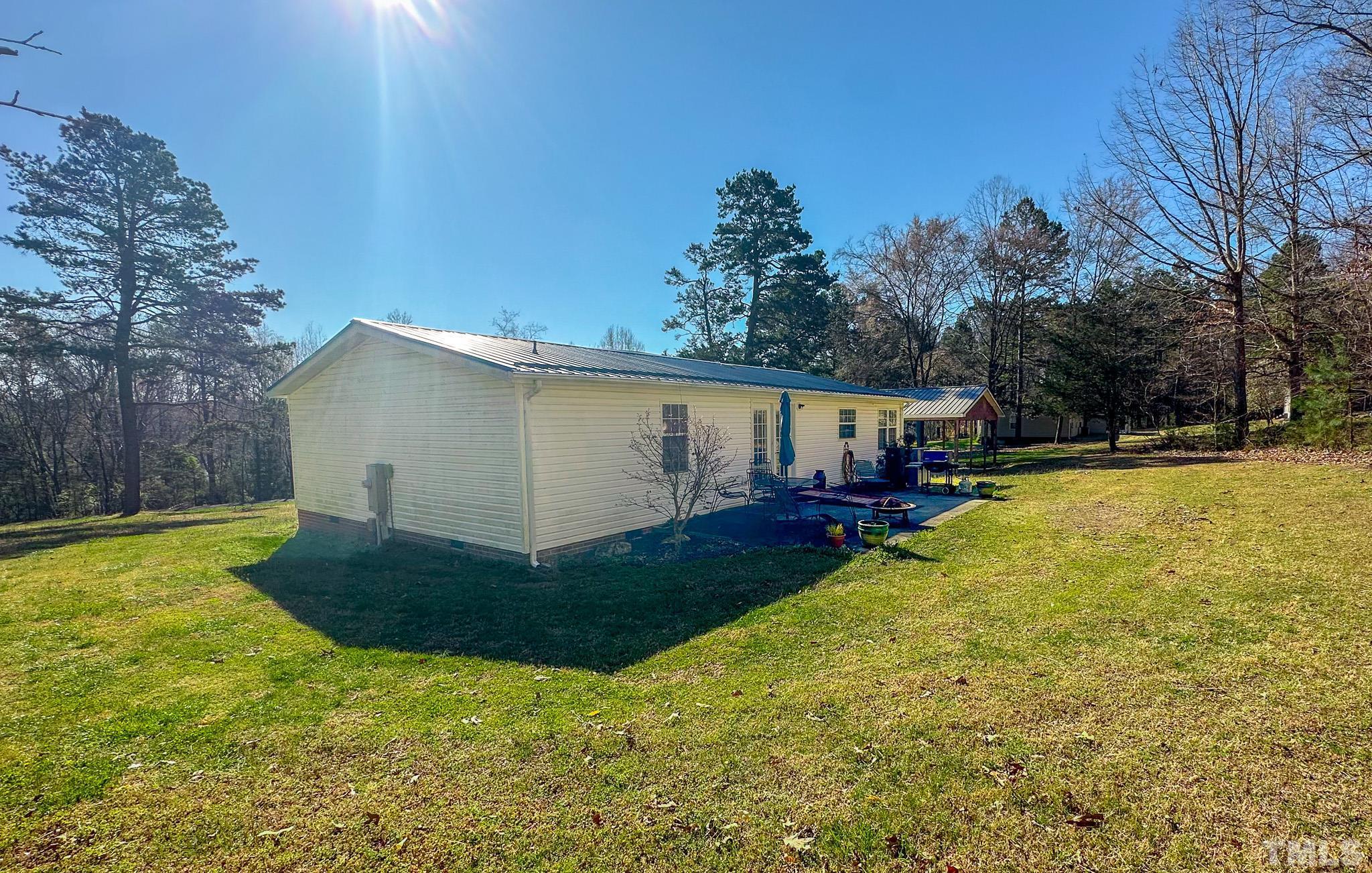 214 Hassel Clayton Road Roxboro, NC 27574 - Photo 26 of 38 a view of a back yard of the house