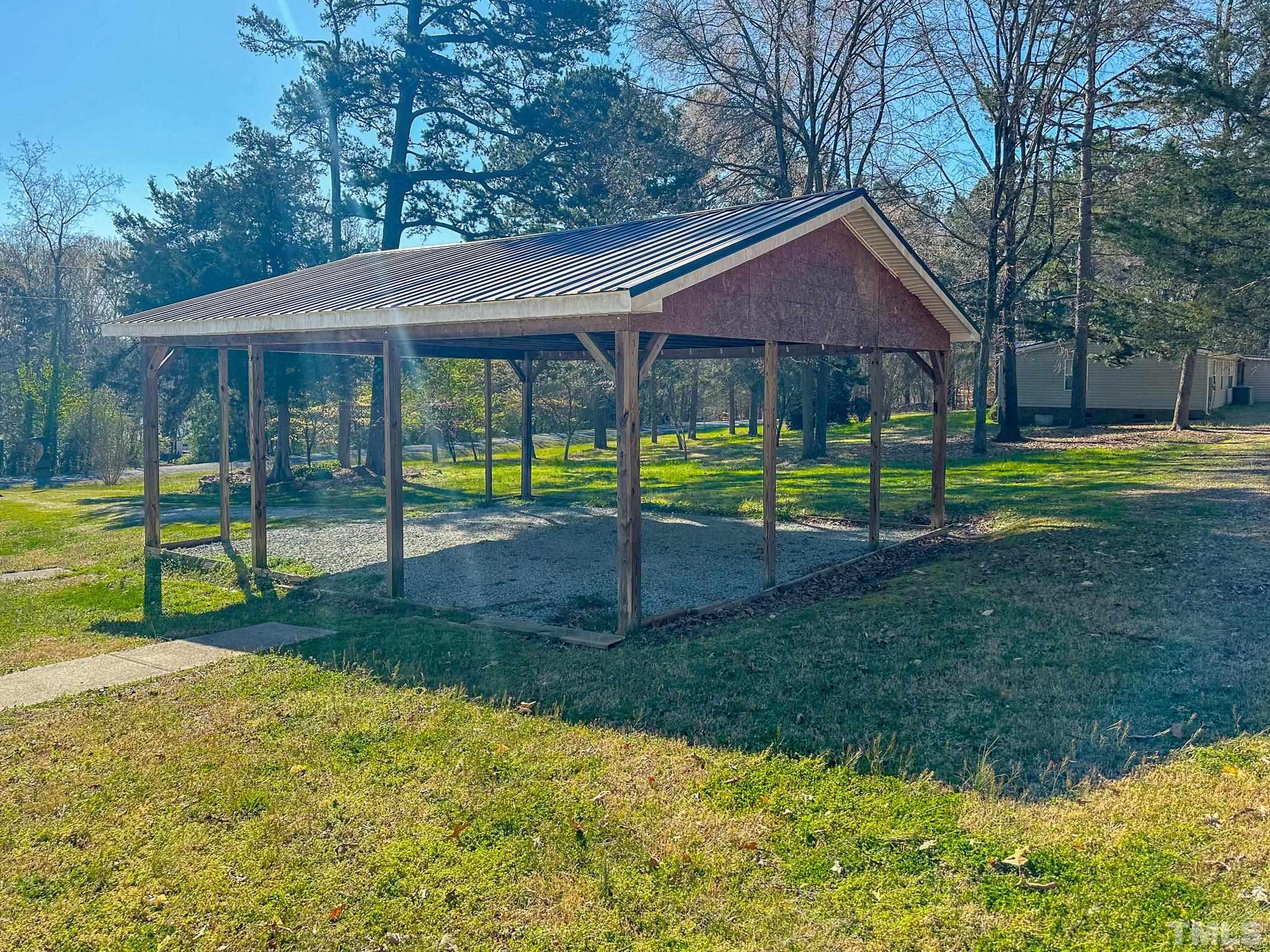 214 Hassel Clayton Road Roxboro, NC 27574 - Photo 27 of 38 a view of a house with a yard