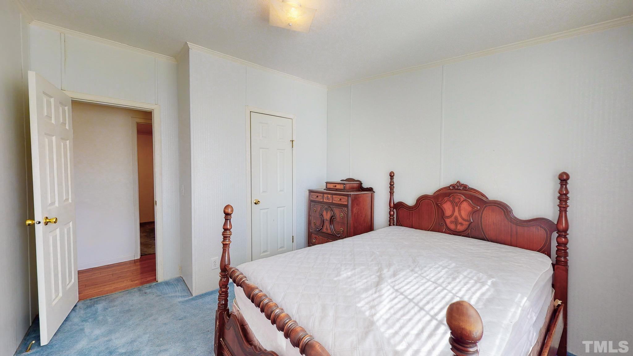 214 Hassel Clayton Road Roxboro, NC 27574 - Photo 30 of 38 a bedroom with bed and closet