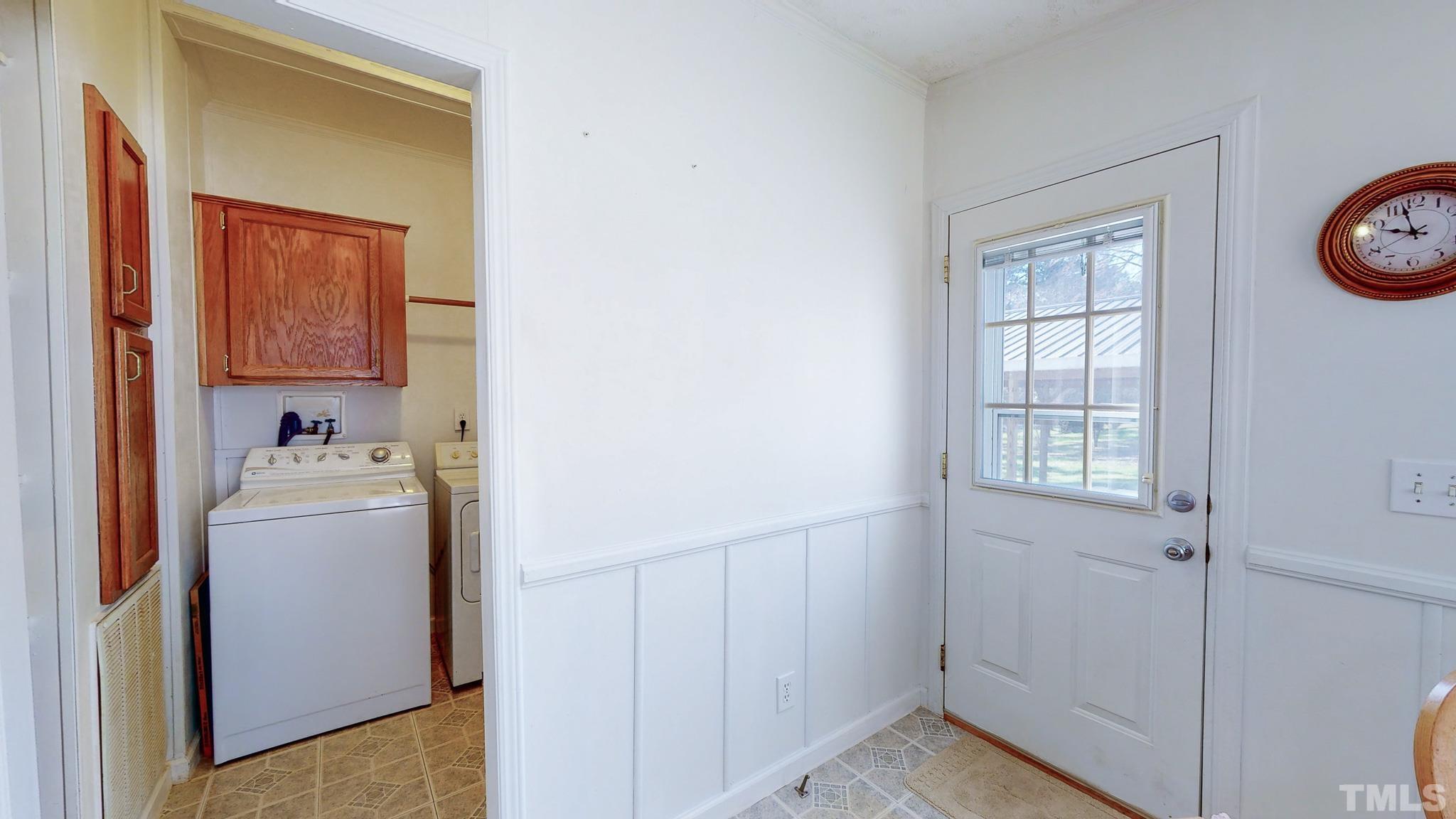 214 Hassel Clayton Road Roxboro, NC 27574 - Photo 35 of 38 a view of utility room with washer and dryer