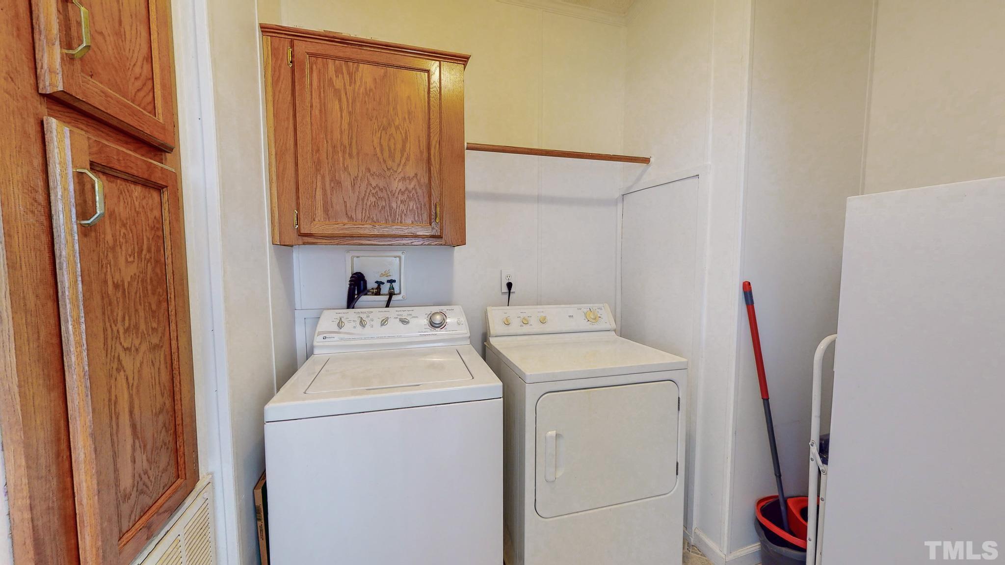 214 Hassel Clayton Road Roxboro, NC 27574 - Photo 37 of 38 a utility room with dryer and washer