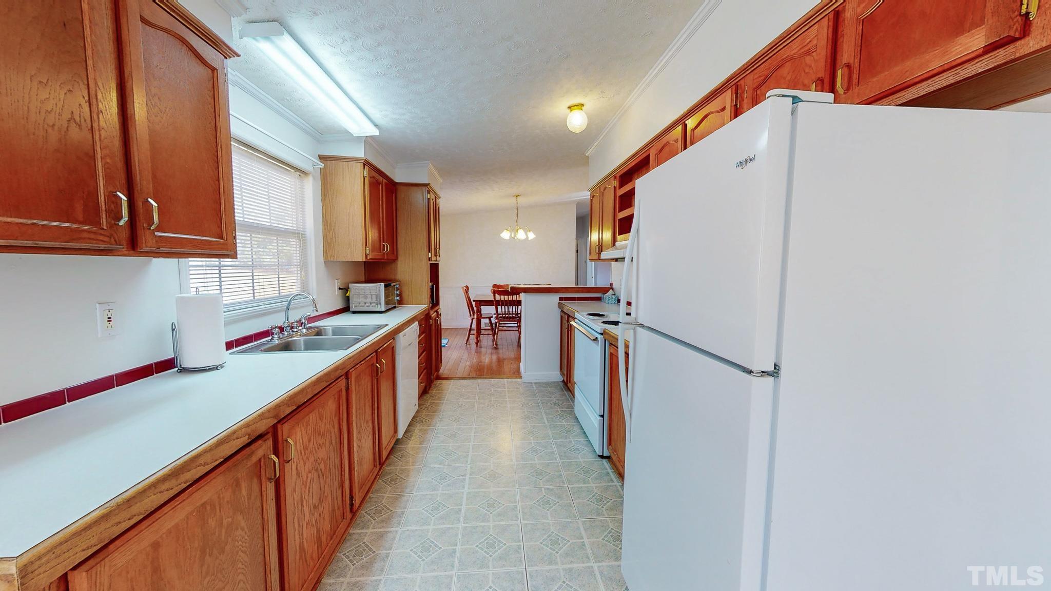 214 Hassel Clayton Road Roxboro, NC 27574 - Photo 10 of 38 a kitchen with counter top space and cabinets