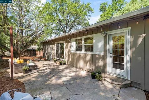 a view of a house with a yard and plants
