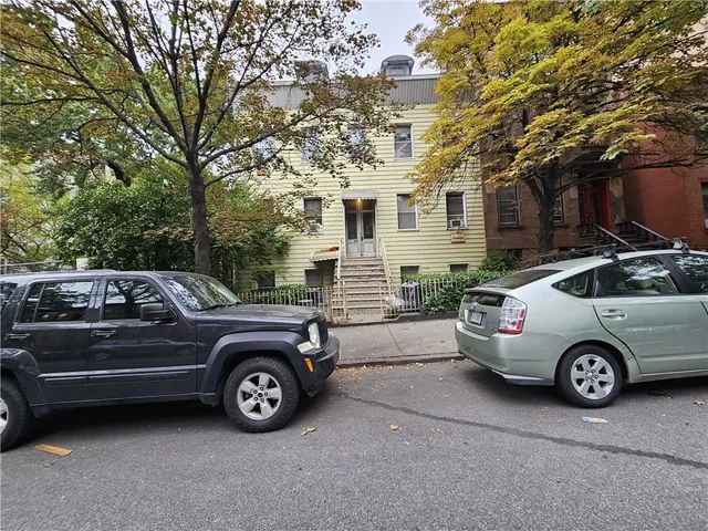 a car parked in front of a house