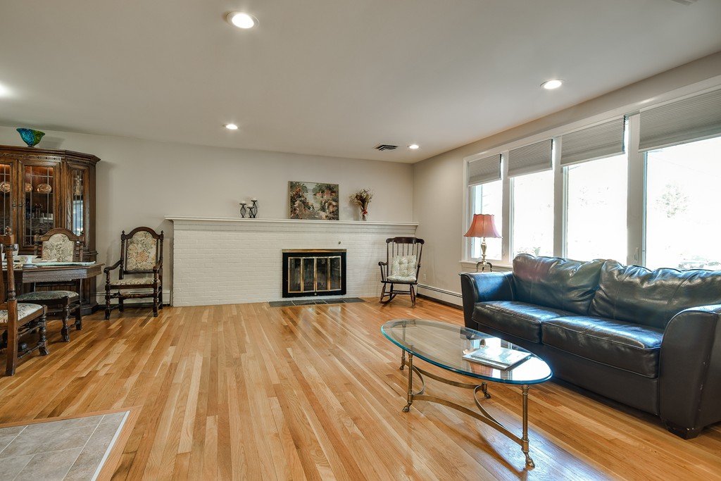 18 Gary Road Needham, MA 02494 - Photo 2 of 29 a living room with furniture and a fireplace