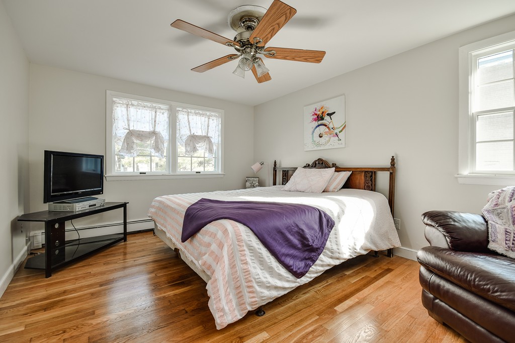 18 Gary Road Needham, MA 02494 - Photo 24 of 29 a bedroom with a bed and a flat screen tv
