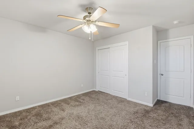 a bathroom with a sink a toilet a mirror and shower