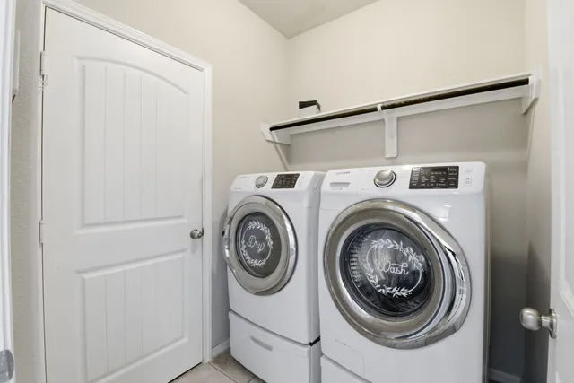 a view of green field with house in background