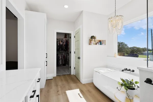 a bathroom with a sink vanity and mirror