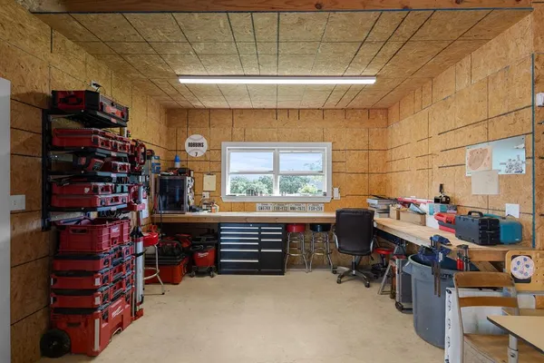 a view of a garage with cars