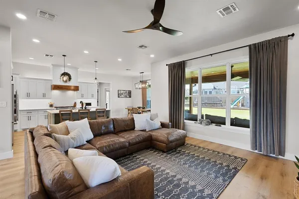 a living room with furniture and a rug