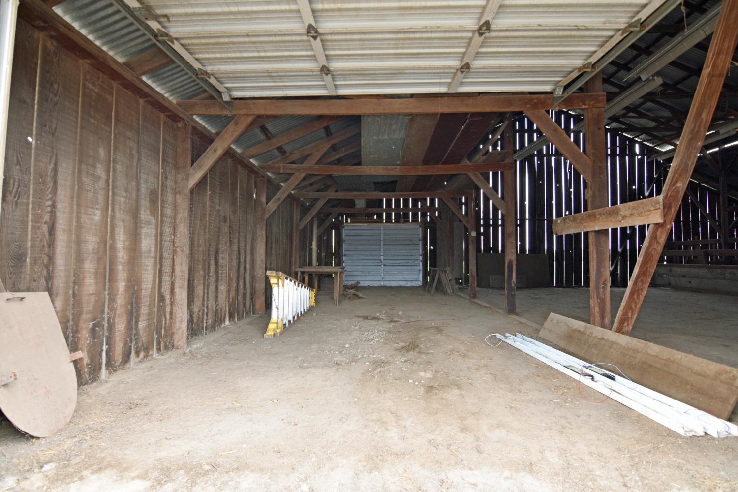1206 South Verduga Road Turlock, CA 95380 - Photo 31 of 36 a view of an empty room with wooden walls