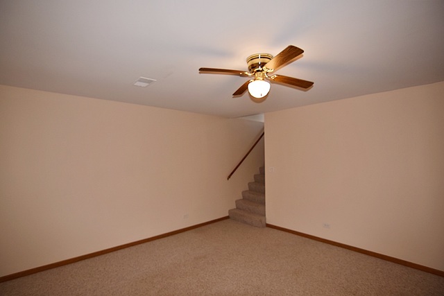 539 Elizabeth Street Maple Park, IL 60151 - Photo 19 of 25 a view of a chandelier fan in a room
