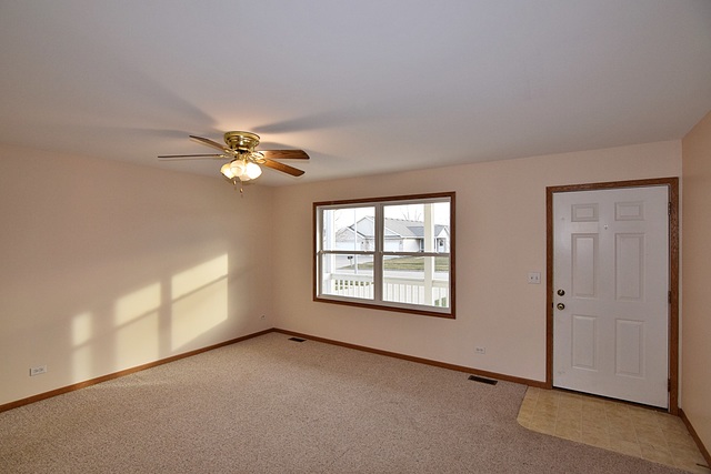 539 Elizabeth Street Maple Park, IL 60151 - Photo 3 of 25 a view of a livingroom with a ceiling fan and window