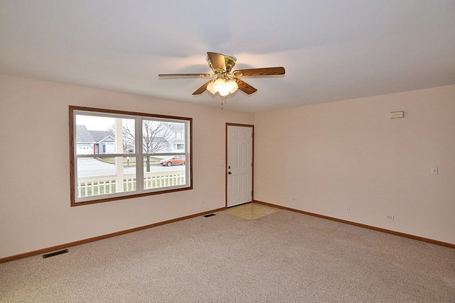 539 Elizabeth Street Maple Park, IL 60151 - Photo 4 of 25 a view of a room with a window and a fan