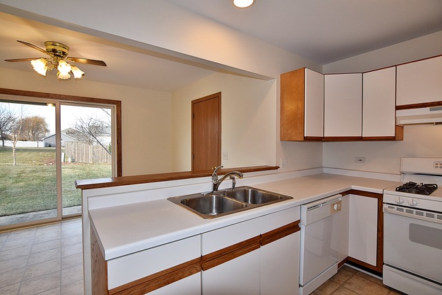 539 Elizabeth Street Maple Park, IL 60151 - Photo 10 of 25 a kitchen that has a sink stove and cabinets