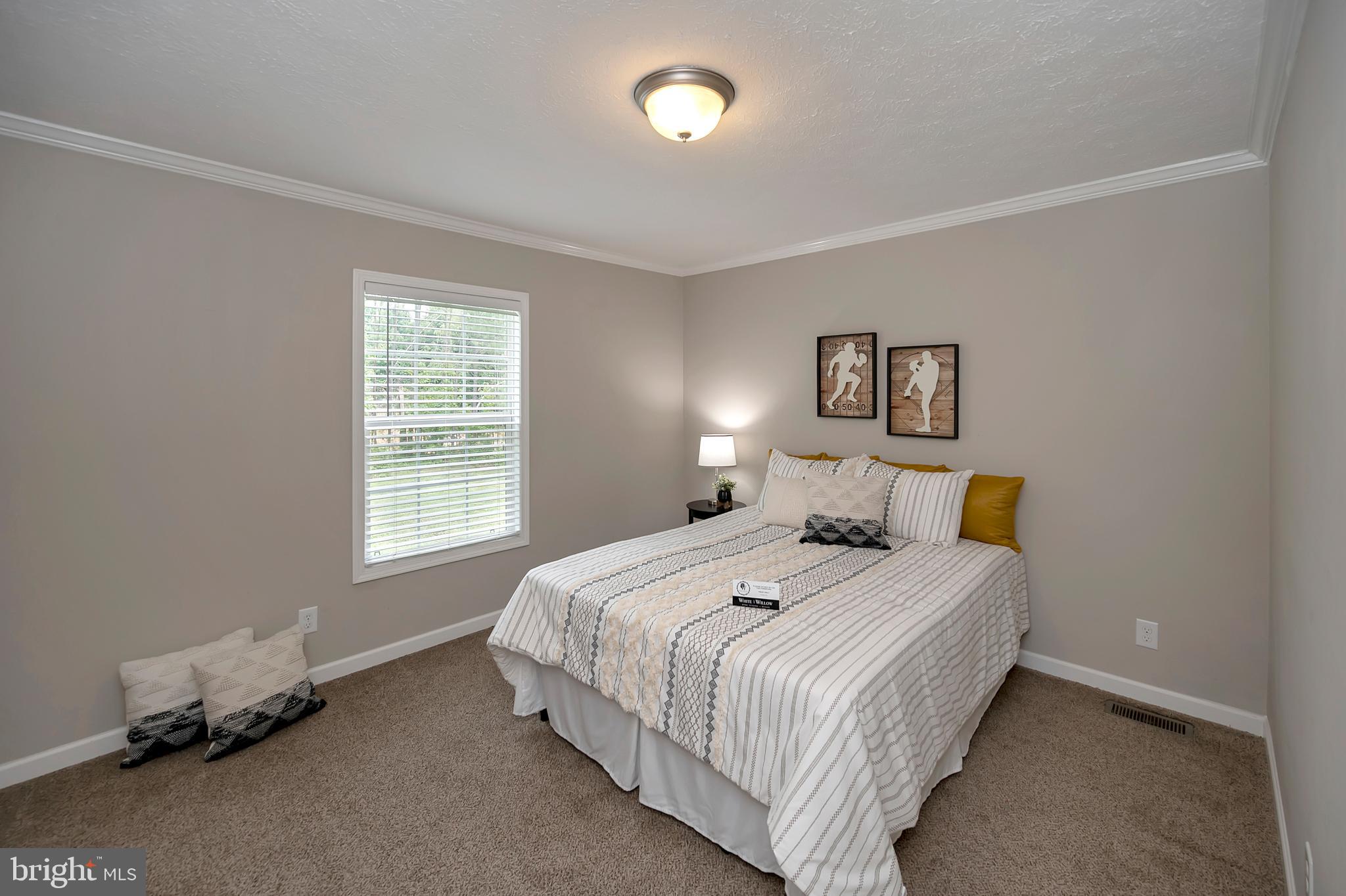 7238 Blanton Road Ruther Glen, VA 22546 - Photo 31 of 41 3rd bedroom with crown molding and walk-in closet.