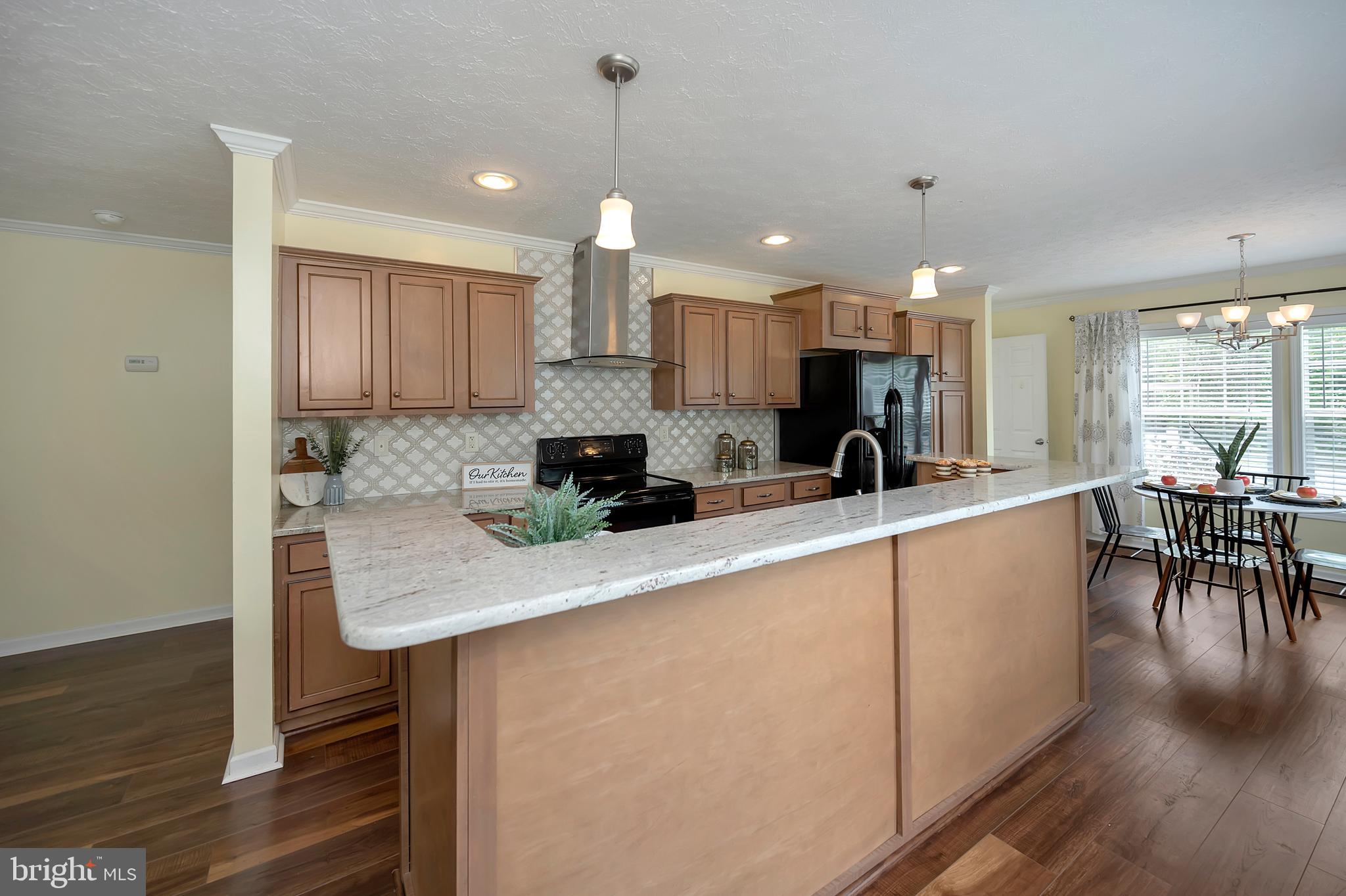 7238 Blanton Road Ruther Glen, VA 22546 - Photo 8 of 41 Kitchen island breakfast bar.