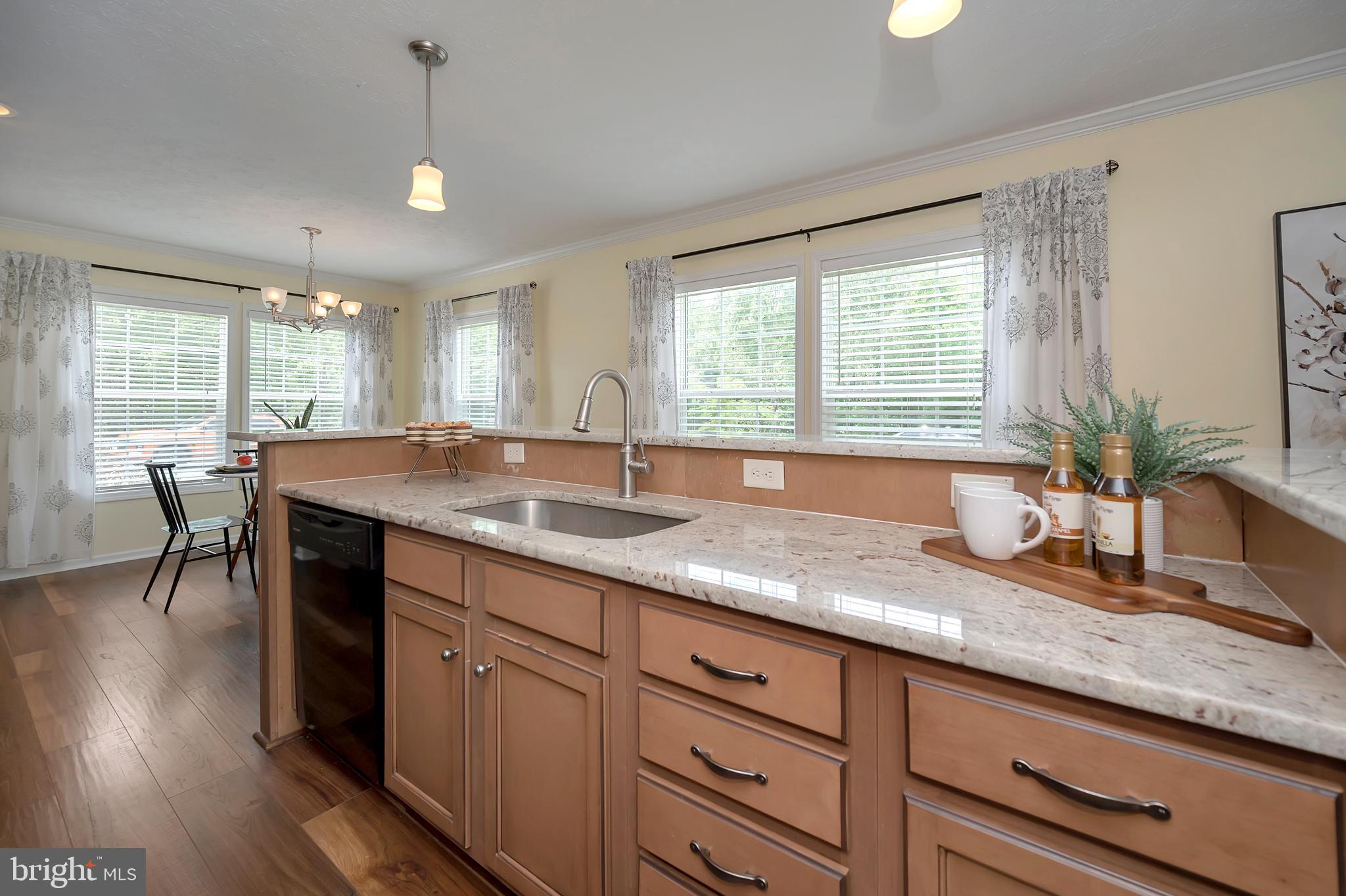 7238 Blanton Road Ruther Glen, VA 22546 - Photo 10 of 41 Granite counters and LVP flooring in the kitchen.