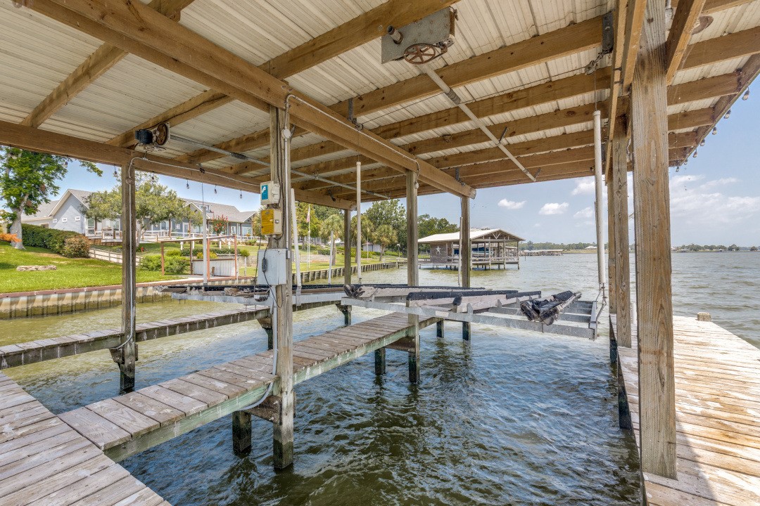 207 Vivian Road Onalaska, TX 77360 - Photo 7 of 34 a view of a patio with a table and chairs