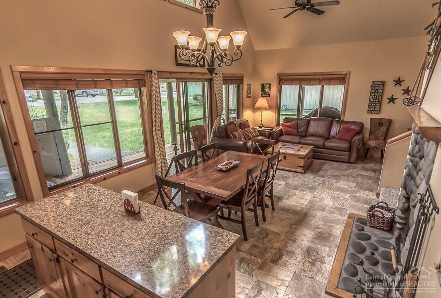 The kitchen, dining and living areas sur