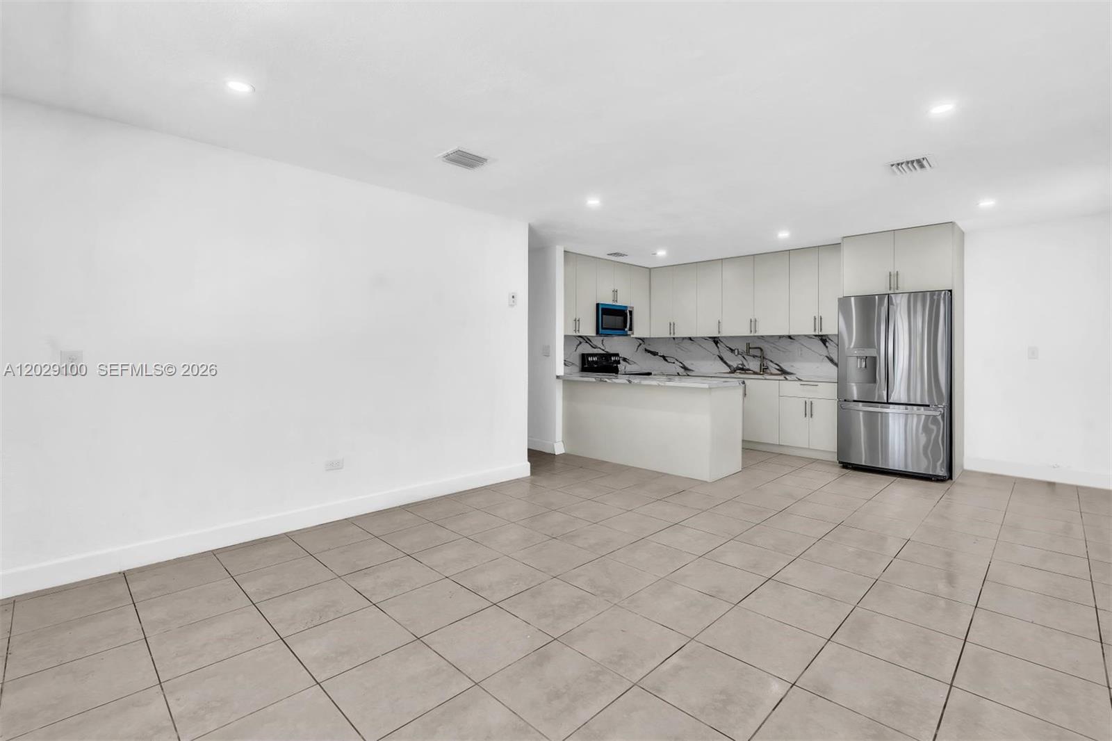 11790 Southwest 34th Street Miami, FL 33175 - Photo 7 of 56 a kitchen with refrigerator and cabinets