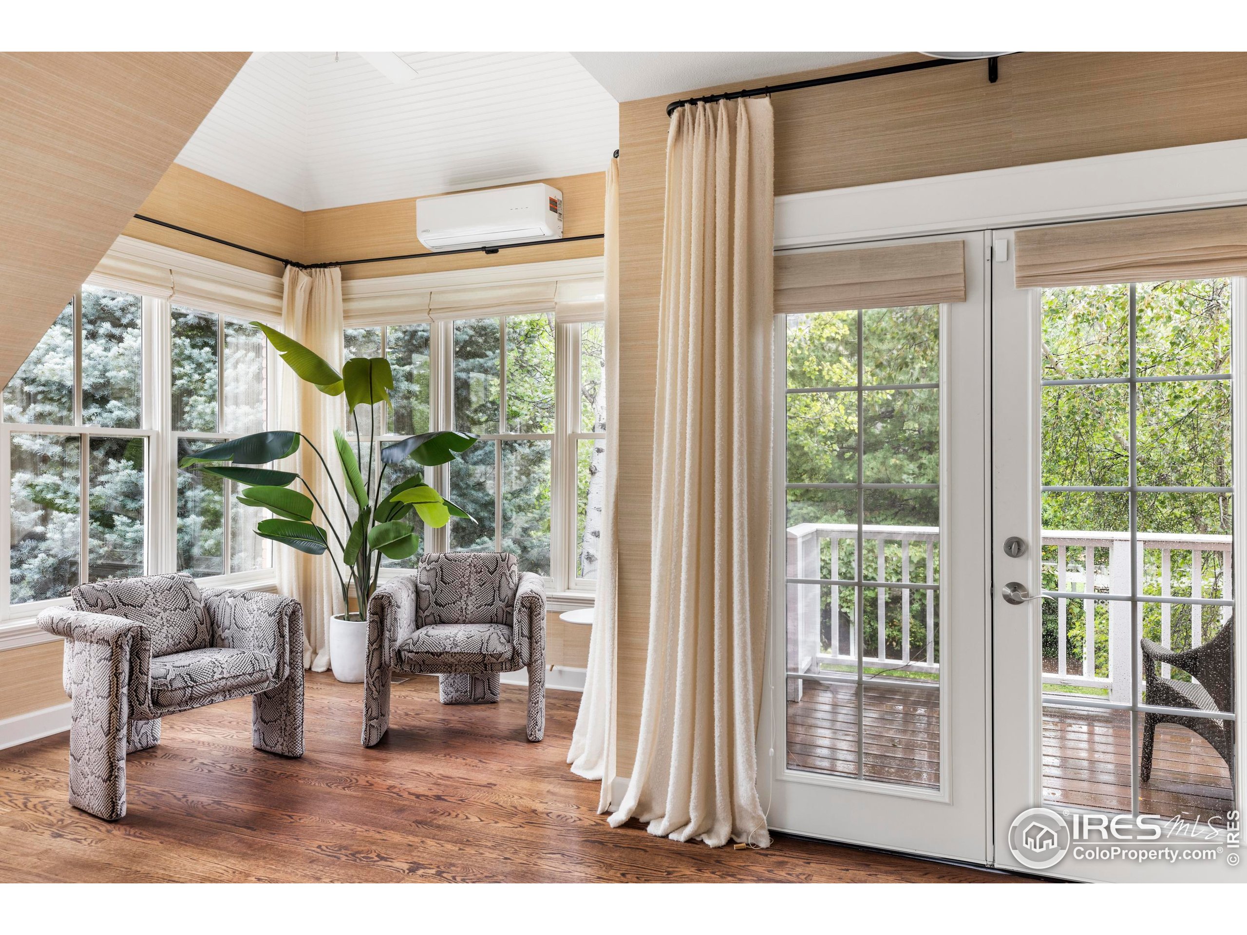 1070 Juniper Avenue Boulder, CO 80304 - Photo 16 of 32 a living room with furniture and floor to ceiling windows