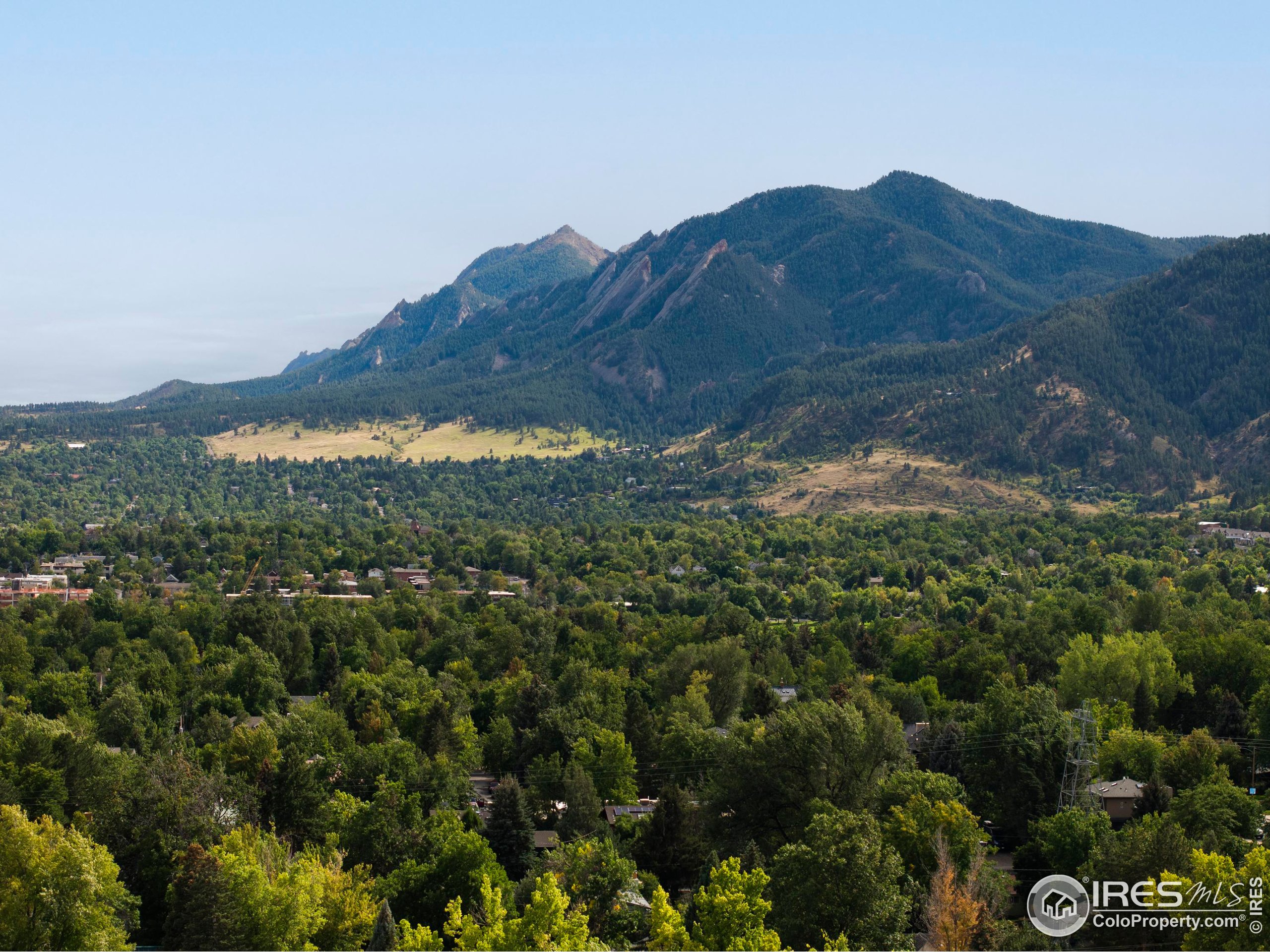 1070 Juniper Avenue Boulder, CO 80304 - Photo 18 of 32 a view of a house with a mountain and a forest
