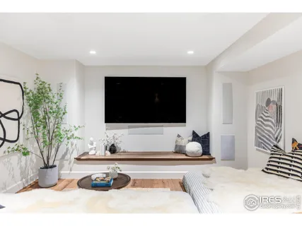 a view of a house with garden and sitting area