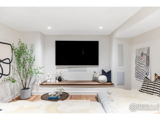 a view of a house with garden and sitting area