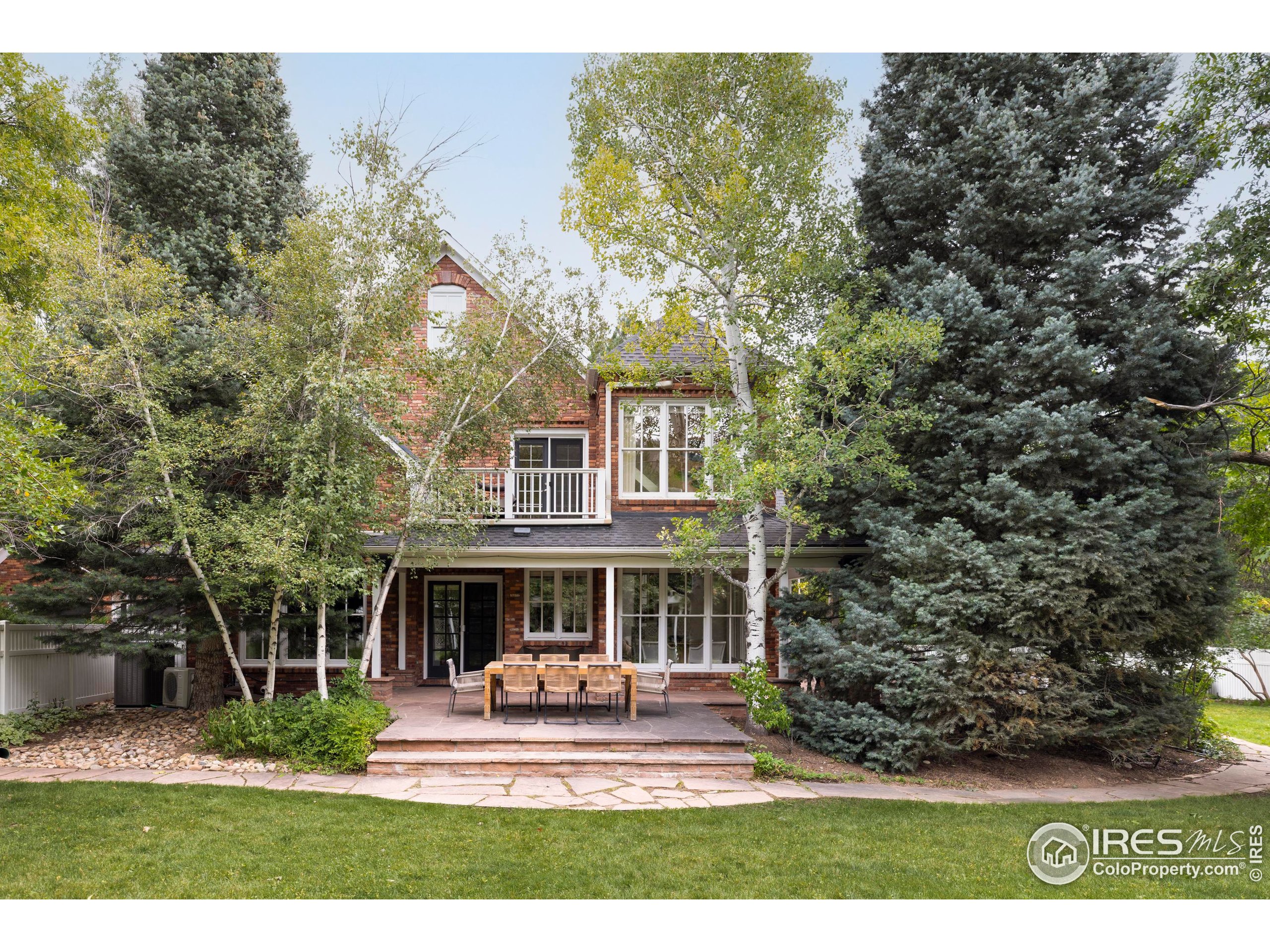 1070 Juniper Avenue Boulder, CO 80304 - Photo 22 of 32 a view of a house with garden and sitting area