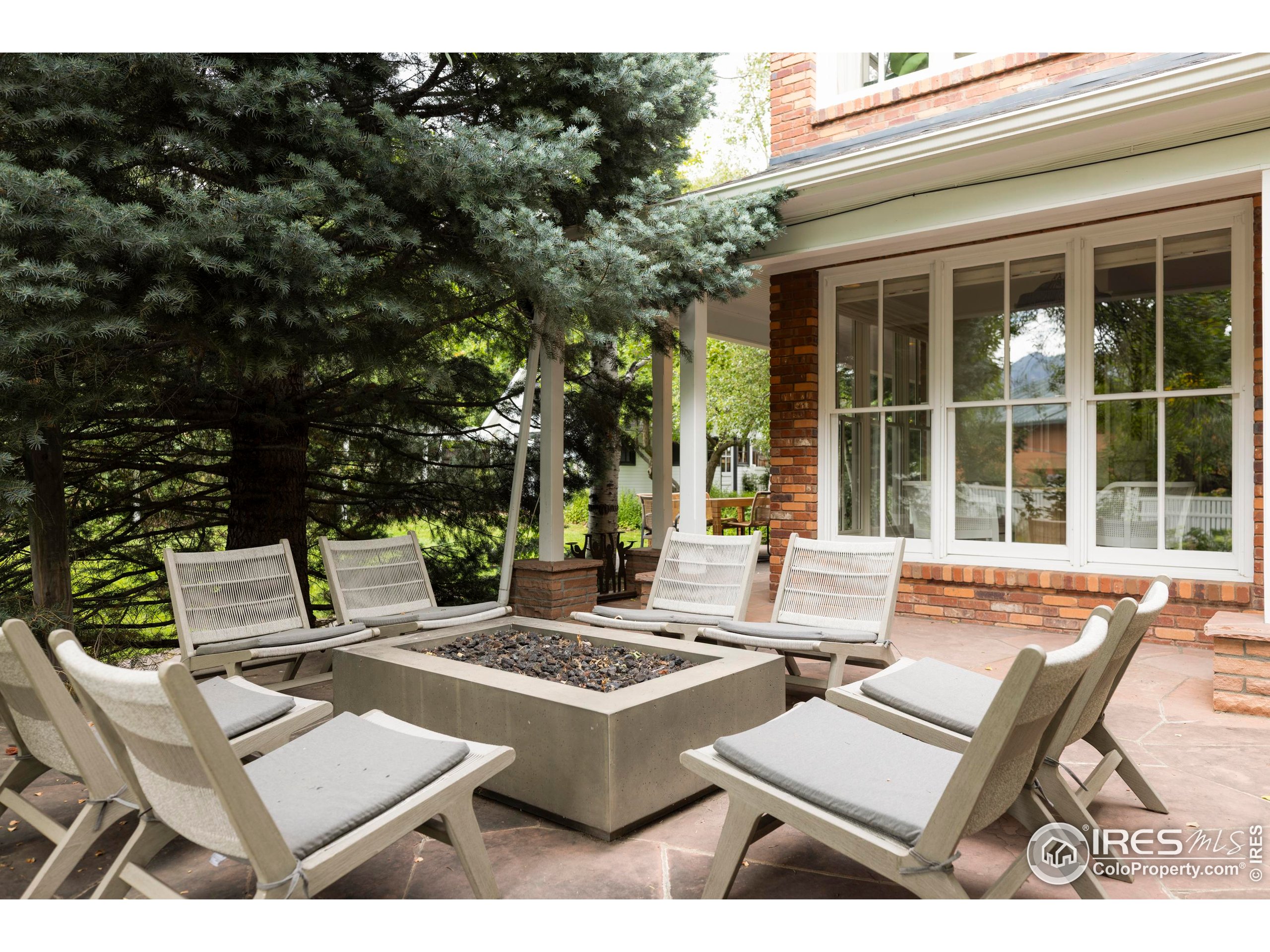 1070 Juniper Avenue Boulder, CO 80304 - Photo 23 of 32 a view of a patio with table and chairs and potted plants