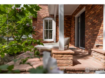 a view of a house with a wooden deck