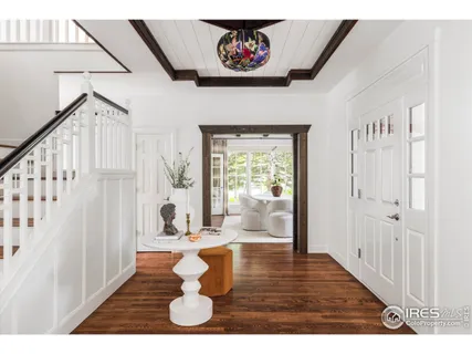 a view of an entryway with wooden floor