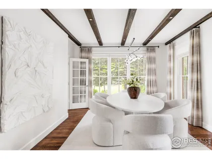 a view of a living room with furniture and wooden floor
