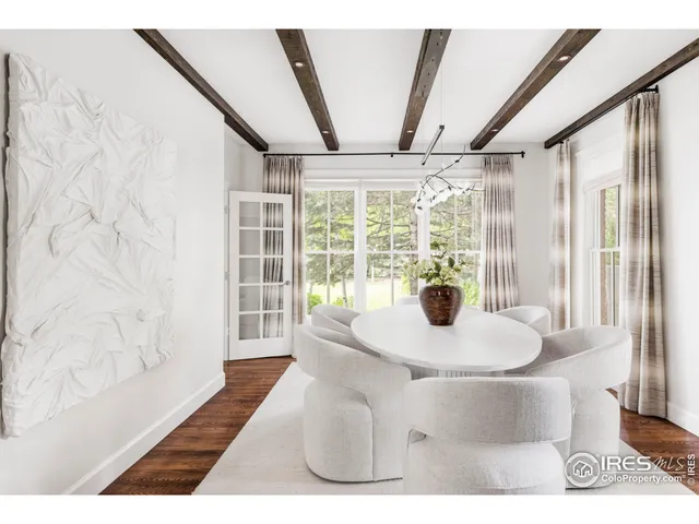 a view of a living room with furniture and wooden floor