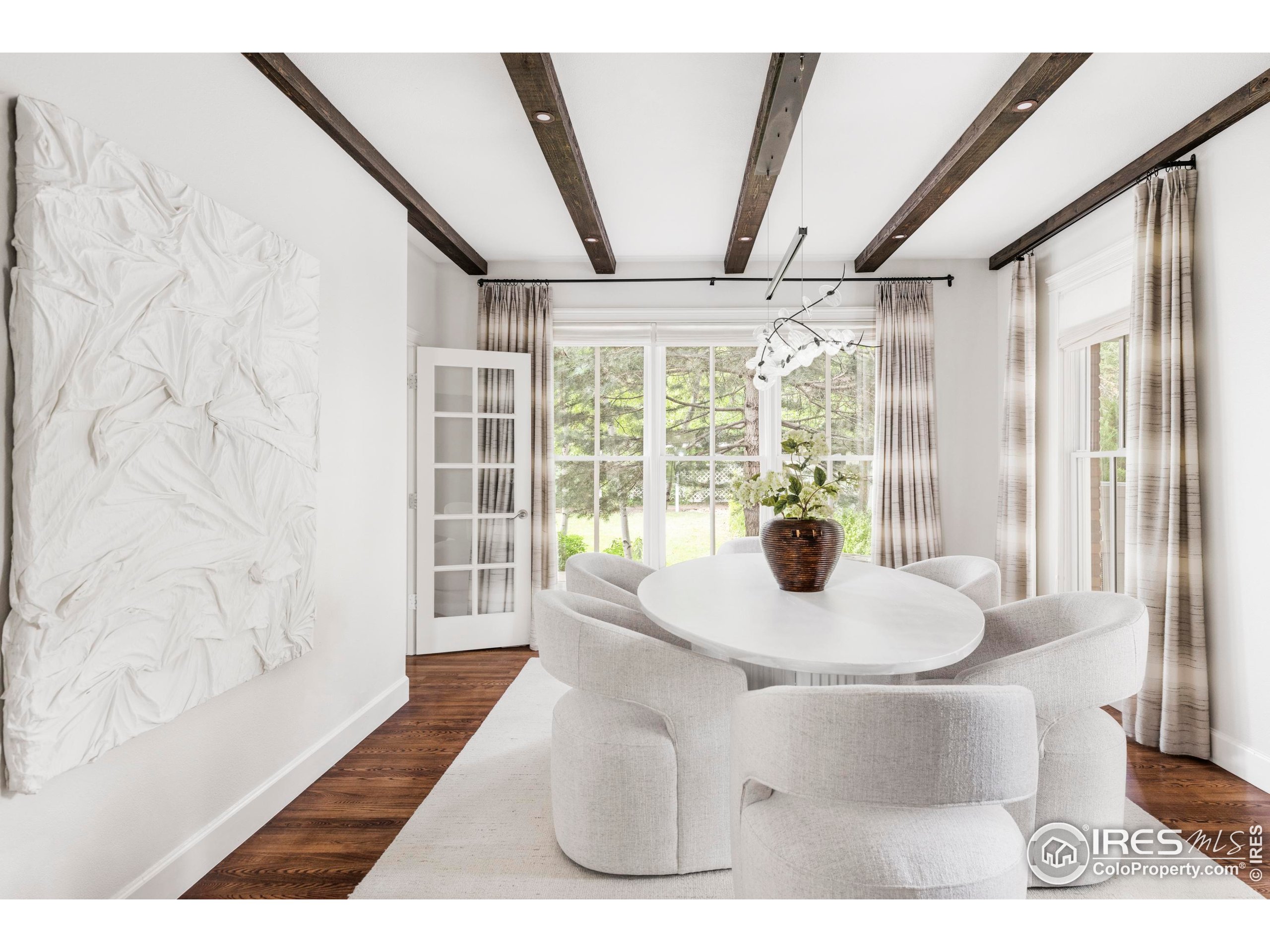 1070 Juniper Avenue Boulder, CO 80304 - Photo 5 of 32 a view of a living room with furniture and wooden floor