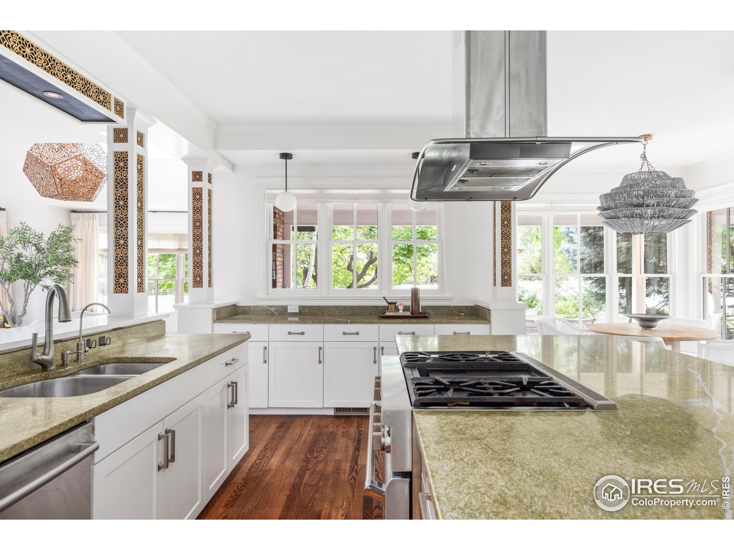 1070 Juniper Avenue Boulder, CO 80304 - Photo 8 of 32 a kitchen with a sink stove and cabinets