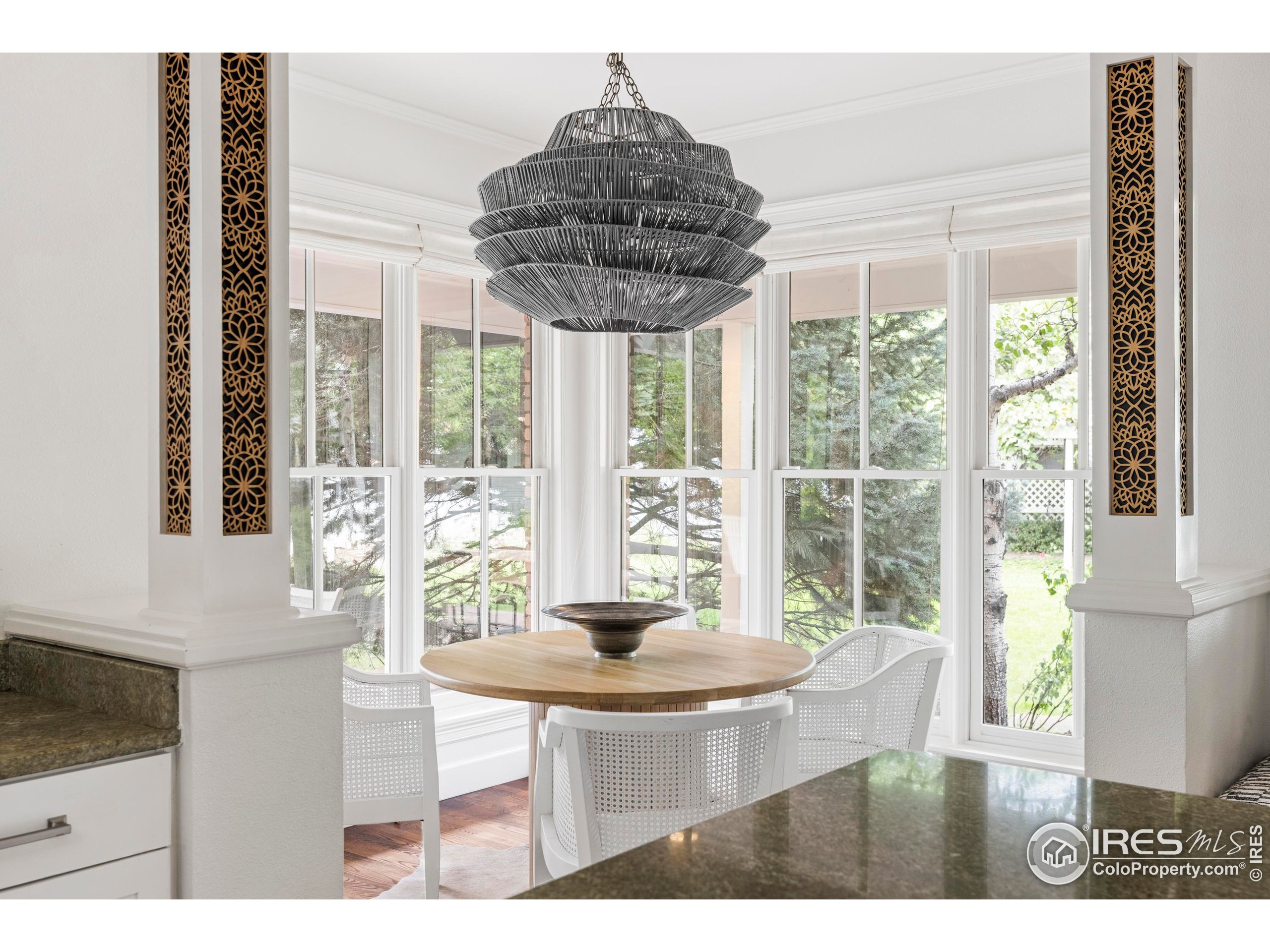 1070 Juniper Avenue Boulder, CO 80304 - Photo 10 of 32 a dining room with furniture and large windows