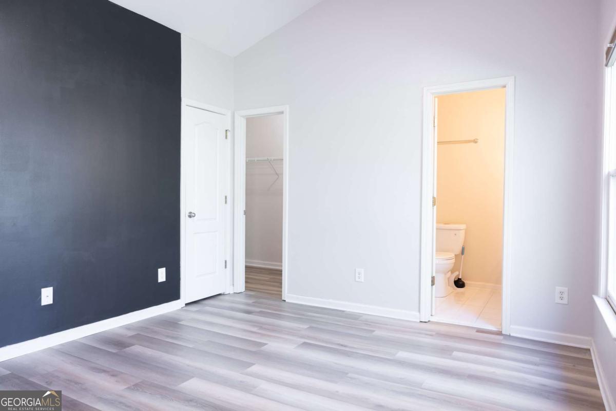 1232 Harris Commons Place, Unit 1232 Roswell, GA 30076 - Photo 14 of 21 a view of a room with wooden floor