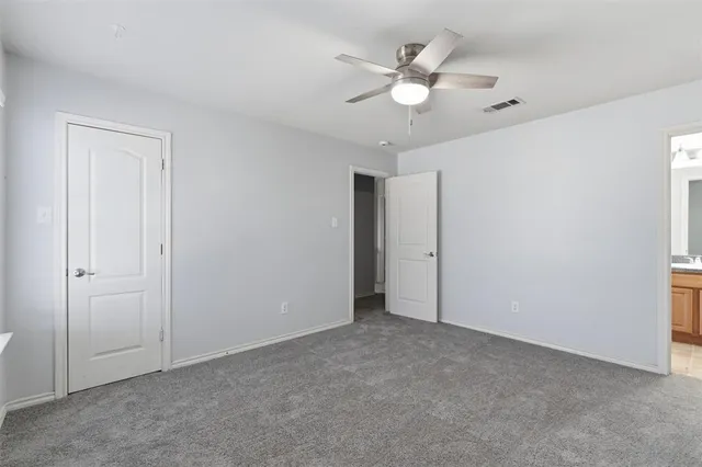 an empty room with fan