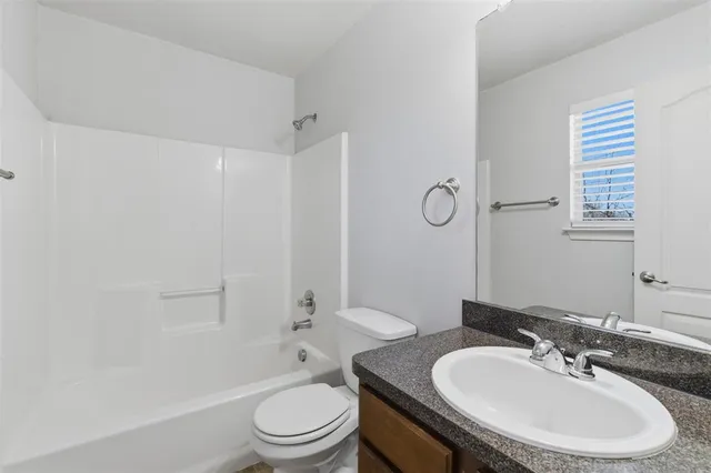 a bathroom with a sink toilet a shower and a bathtub