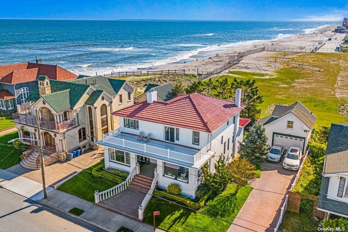 a aerial view of a house with a ocean view